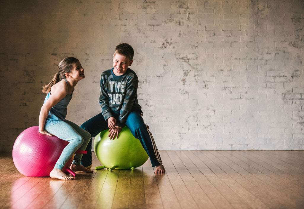 How Sitting on a Ball Helps Kids Focus and Do Better In School
